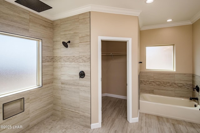 bathroom with a bath, a healthy amount of sunlight, ornamental molding, and a tile shower