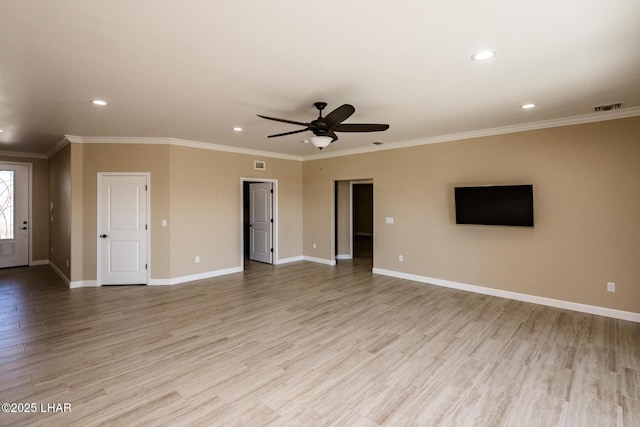 unfurnished living room with visible vents, light wood-style flooring, a ceiling fan, ornamental molding, and baseboards