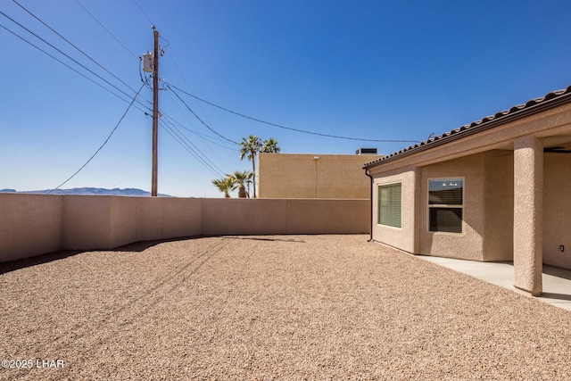 view of yard featuring a patio and fence