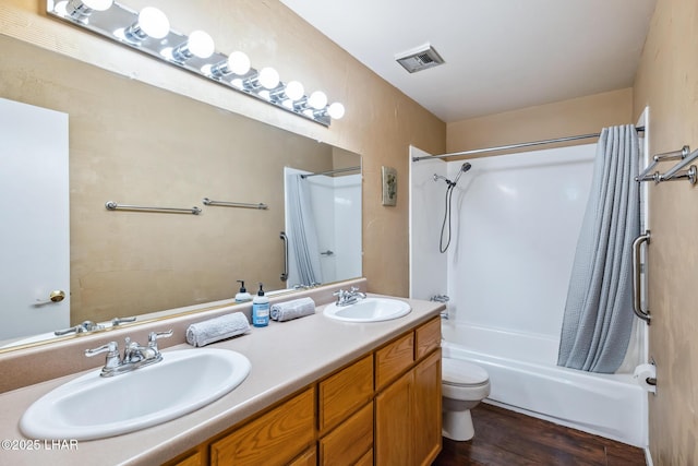 2100 Swanson Ave Unit 208, Lake Havasu City, AZ 86403 - bathroom with shower / tub combo, wood finished floors, double vanity, and toilet