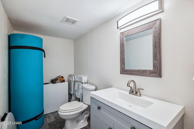2100 Swanson Ave Unit 208, Lake Havasu City, AZ 86403 - bathroom with wood finished floors, toilet, and vanity