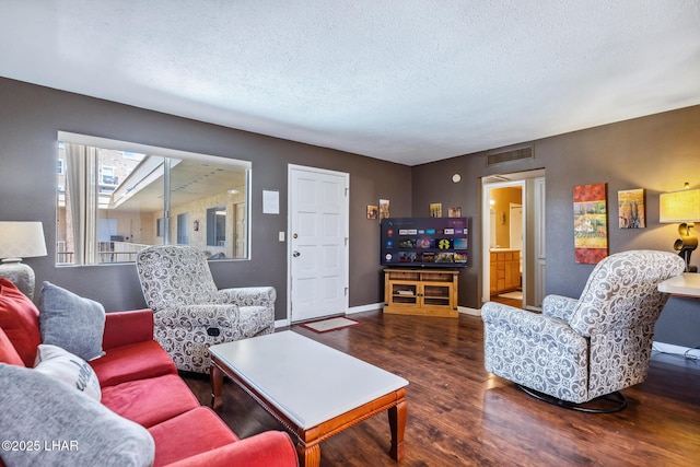 2100 Swanson Ave Unit 208, Lake Havasu City, AZ 86403 - living area featuring wood finished floors, a textured ceiling, and baseboards