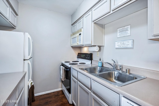 2100 Swanson Ave Unit 208, Lake Havasu City, AZ 86403 - kitchen with white appliances, a sink, dark wood finished floors, baseboards, and light countertops