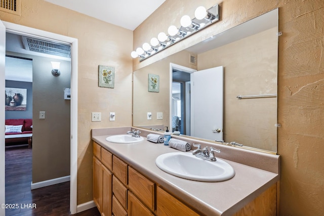 2100 Swanson Ave Unit 208, Lake Havasu City, AZ 86403 - bathroom with wood finished floors, double vanity, and baseboards
