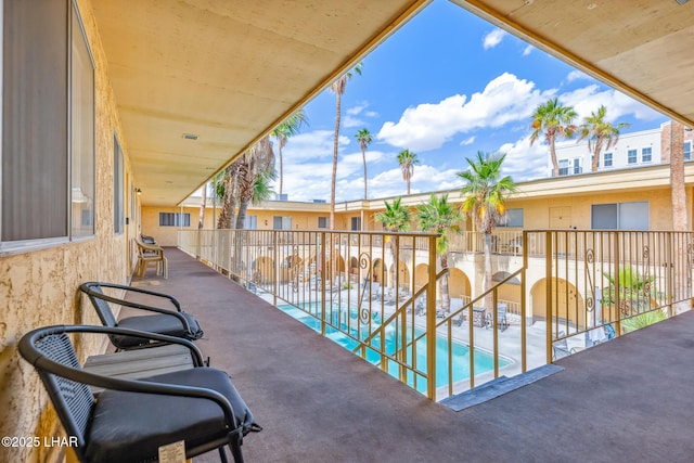 2100 Swanson Ave Unit 208, Lake Havasu City, AZ 86403 - balcony with view of pool and a patio