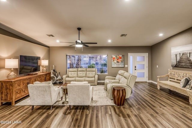 living room featuring wood-type flooring and ceiling fan