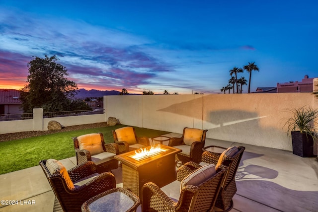 patio terrace at dusk with a fire pit