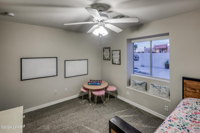 bedroom featuring ceiling fan and dark carpet