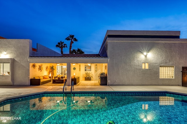 view of swimming pool with a patio and outdoor lounge area