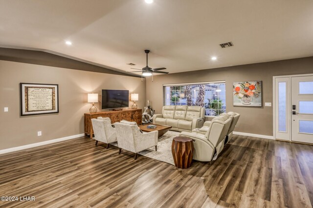 living room with wood-type flooring, ceiling fan, and vaulted ceiling