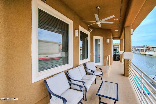 8839 Yaqui Loop, Parker, AZ 85344 - view of patio / terrace with a balcony, a water view, and ceiling fan