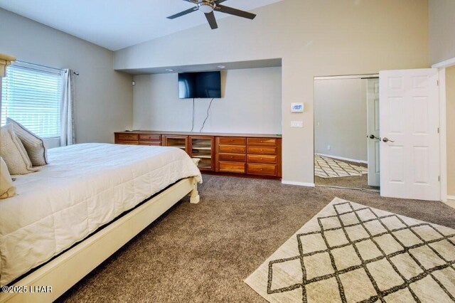 8839 Yaqui Loop, Parker, AZ 85344 - carpeted bedroom featuring vaulted ceiling, baseboards, and ceiling fan