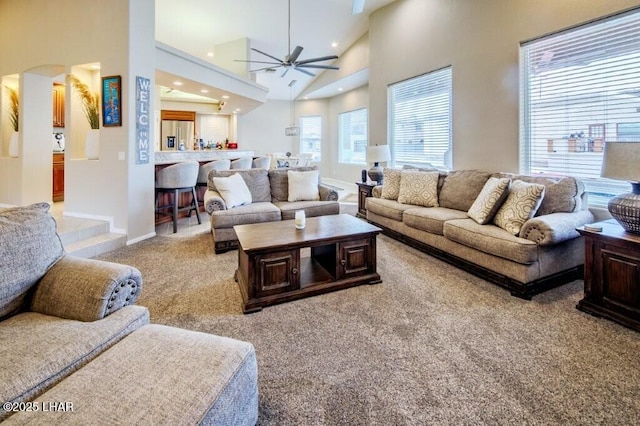 8839 Yaqui Loop, Parker, AZ 85344 - living area with light colored carpet, a ceiling fan, arched walkways, a high ceiling, and recessed lighting