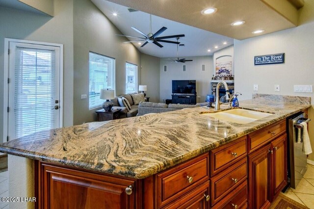 8839 Yaqui Loop, Parker, AZ 85344 - kitchen featuring a sink, a ceiling fan, dishwasher, light stone countertops, and recessed lighting