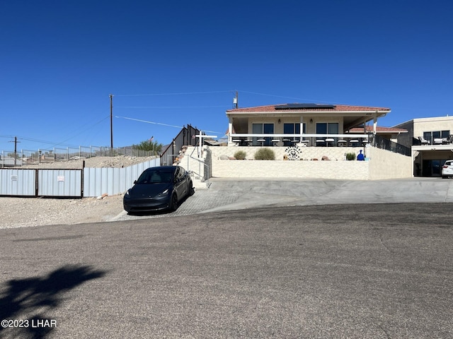 view of front of home featuring solar panels