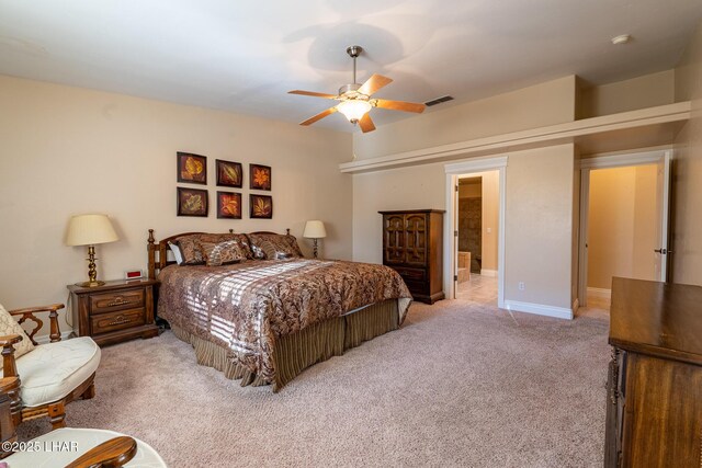 bedroom featuring light colored carpet and ceiling fan