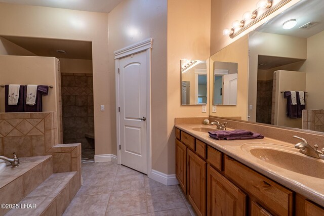 bathroom with vanity, plus walk in shower, and tile patterned flooring