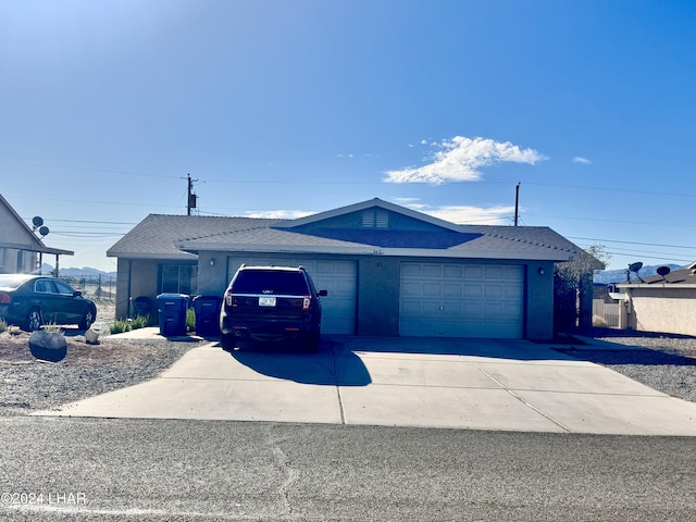 single story home with a garage