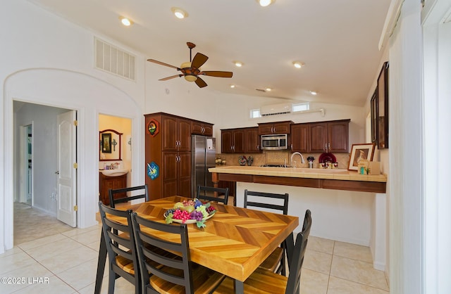 49605 Felspar Ave, Quartzsite, AZ 85346 - dining room featuring ceiling fan, lofted ceiling, and light tile patterned floors