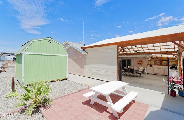 49605 Felspar Ave, Quartzsite, AZ 85346 - view of shed featuring outdoor dining area and area for grilling