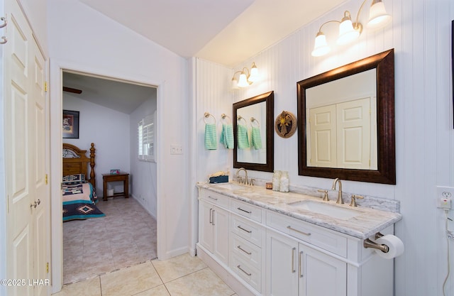 49605 Felspar Ave, Quartzsite, AZ 85346 - bathroom with double vanity, tile patterned floors, and vaulted ceiling