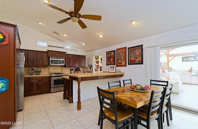 49605 Felspar Ave, Quartzsite, AZ 85346 - dining space featuring vaulted ceiling, ceiling fan, light tile patterned floors, recessed lighting, and plenty of natural light