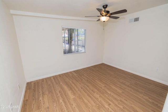 31447 Marine Dr, Parker, AZ 85344 - unfurnished room featuring light wood-style floors, visible vents, baseboards, and a ceiling fan