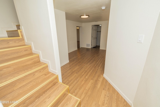 31447 Marine Dr, Parker, AZ 85344 - staircase with wood finished floors, baseboards, and visible vents
