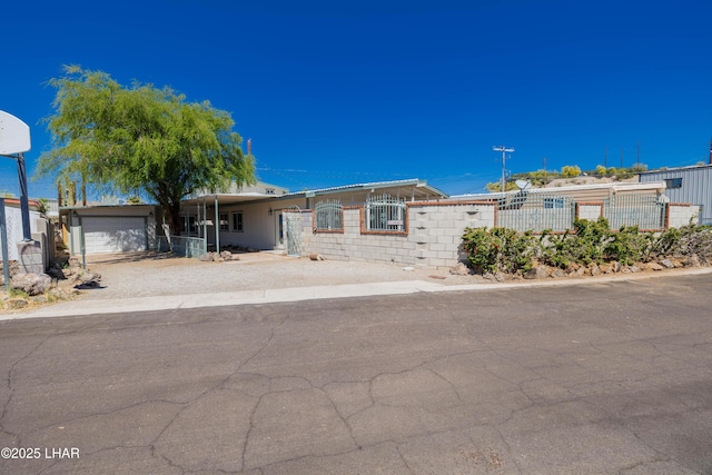 31447 Marine Dr, Parker, AZ 85344 - view of front of property with an attached garage, driveway, and a fenced front yard