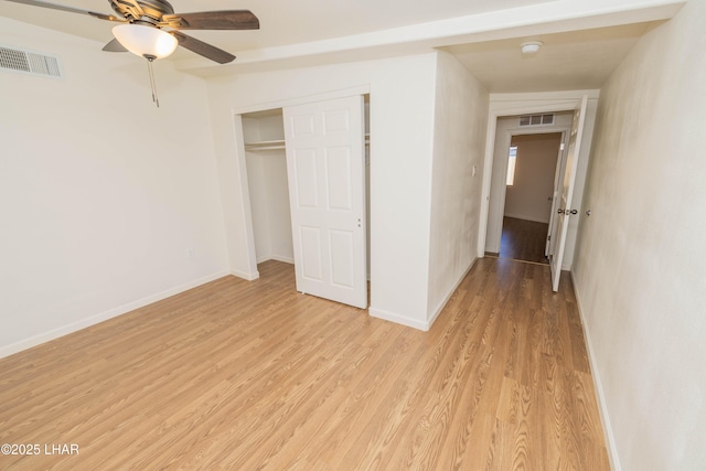 31447 Marine Dr, Parker, AZ 85344 - unfurnished bedroom with visible vents, baseboards, a closet, and light wood-style floors