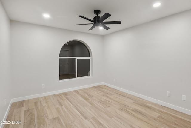 spare room featuring ceiling fan, baseboards, wood finished floors, and recessed lighting