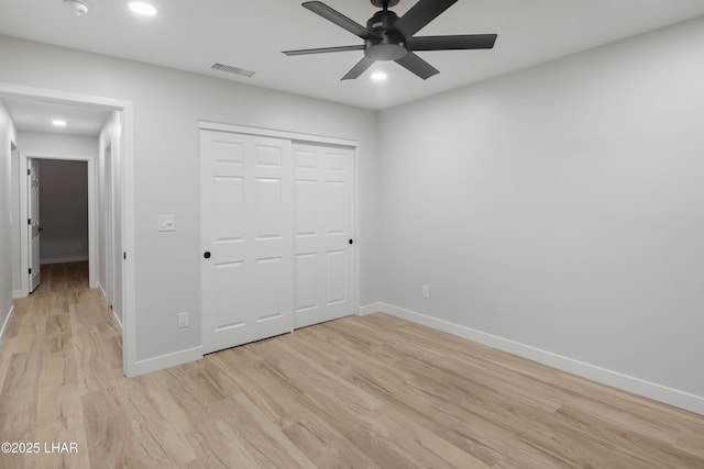 unfurnished bedroom with recessed lighting, visible vents, light wood-style flooring, and baseboards