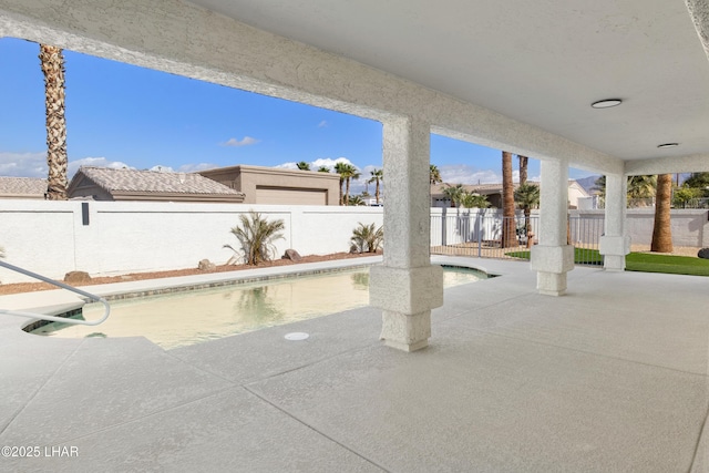 view of patio / terrace featuring a fenced backyard and a fenced in pool