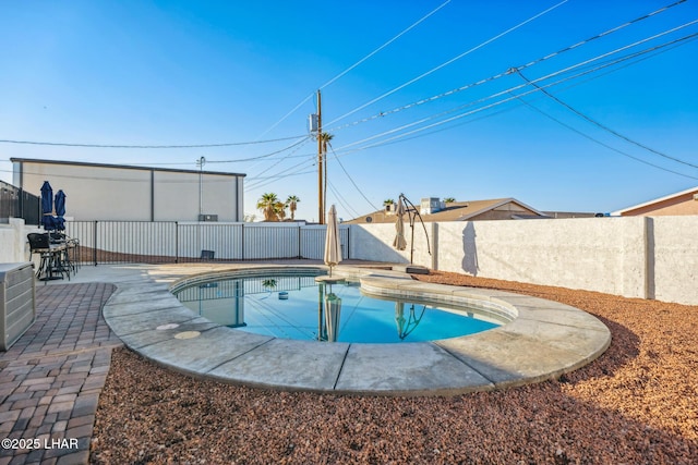 view of swimming pool with a patio area, a fenced backyard, and a fenced in pool