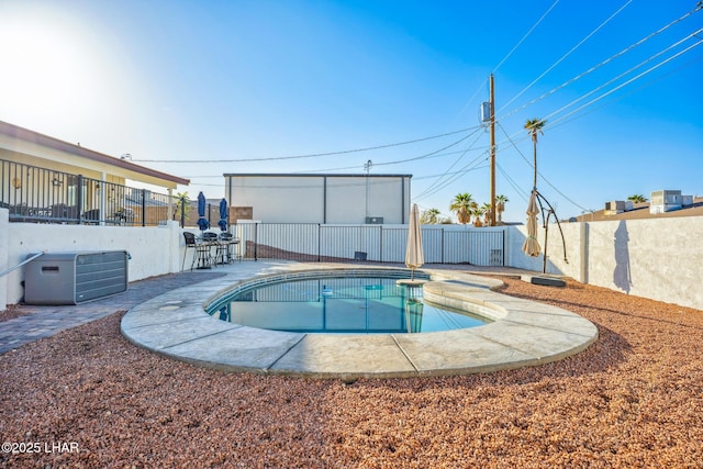 view of swimming pool featuring a fenced in pool, a fenced backyard, and a patio area