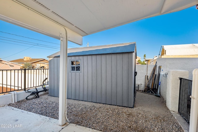 view of shed with a fenced backyard