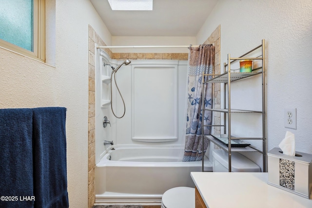 full bathroom featuring vanity, a skylight, toilet, a textured wall, and shower / tub combo with curtain