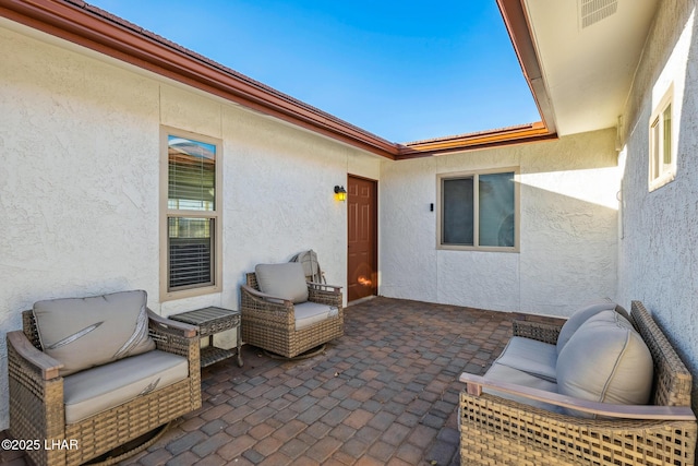 view of patio / terrace featuring visible vents