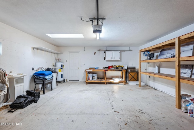 garage with water heater and a garage door opener