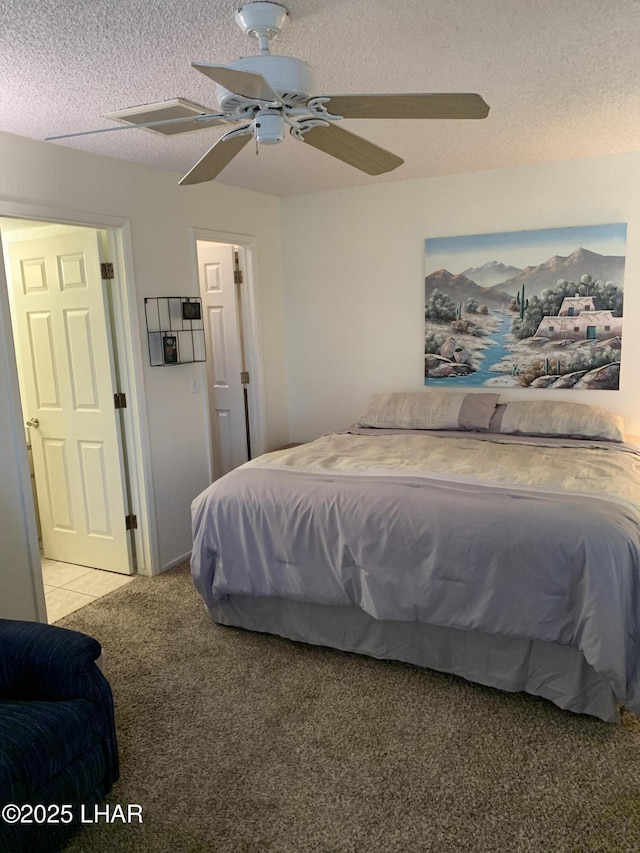 1989 Mesquite Ave Unit 2, Lake Havasu City, AZ 86403 - bedroom featuring carpet floors, a textured ceiling, and a ceiling fan