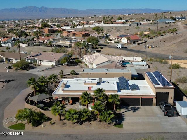 birds eye view of property with a mountain view