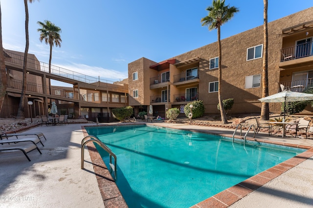 community pool featuring a patio area