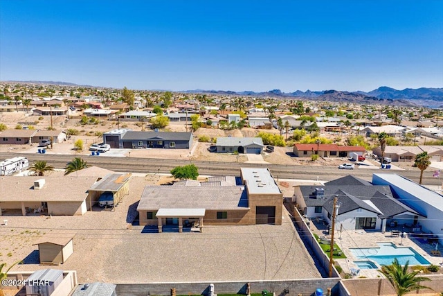 birds eye view of property featuring a mountain view