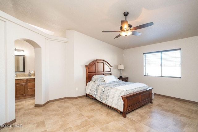 bedroom featuring ceiling fan and ensuite bathroom