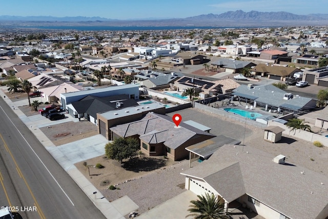 birds eye view of property with a mountain view