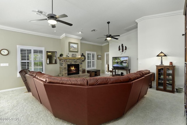 living area featuring ceiling fan, a fireplace, light colored carpet, and ornamental molding