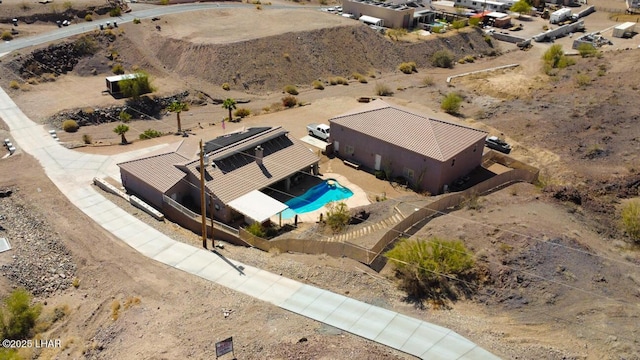 birds eye view of property featuring a desert view