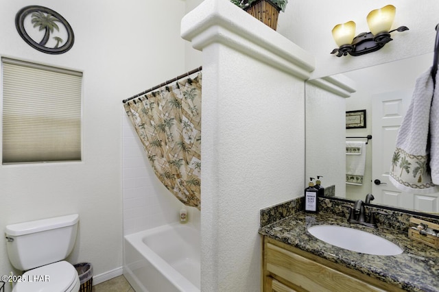 bathroom with tile patterned floors, shower / bath combo with shower curtain, toilet, baseboards, and vanity