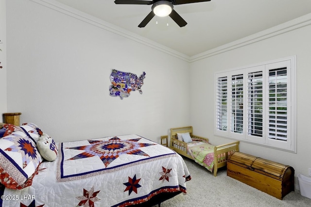 bedroom with carpet flooring, ceiling fan, and ornamental molding