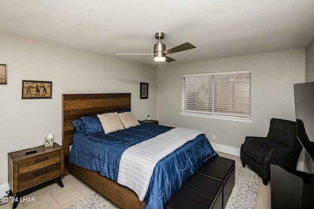 bedroom with light tile patterned flooring and ceiling fan